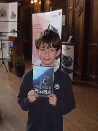 Child holds free copy of book